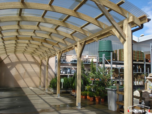 Laminated wood constructions of covered walkways, pathways, canopies, exhibition halls and commercial areas