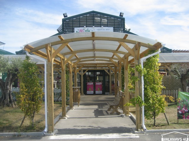 Walkway Canopies, pathway covers, wooden constructions,  entrance canopy, timber shelters, laminated curved room beams, commercial buildings covered areas glazed