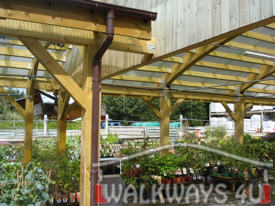Covered canopies, pathways and walkways made from high quality laminated wood. Design, delivery and assembly