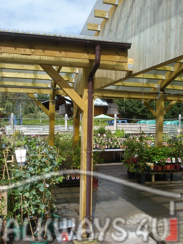 Covered canopies, pathways and walkways made from high quality laminated wood. Design, delivery and assembly